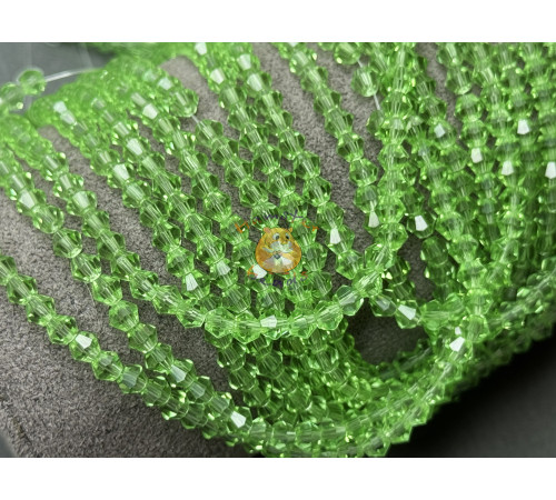 Биконусы стеклянные Peridot #27 4 мм/ 1 нить